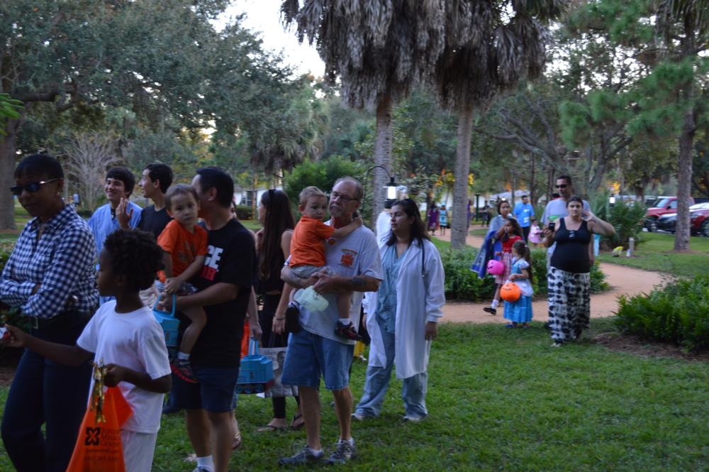 People walk to Fall Festival area